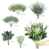 A collection of mixed artificial eucalyptus leaves in various sizes and arrangements for DIY decor.