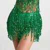 A vibrant green fringe skirt made of sequins with tassel belts worn by a model.