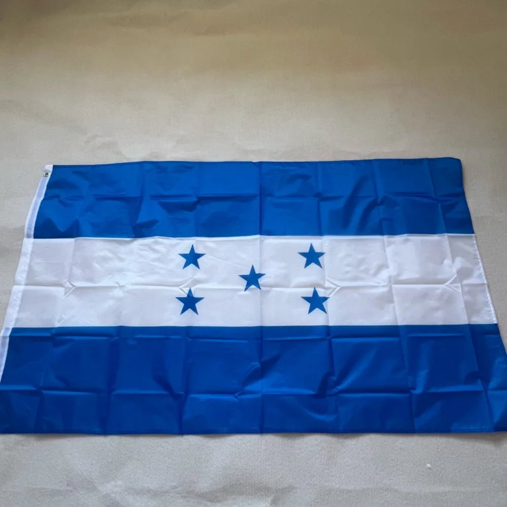 A blue and white flag of Honduras with five blue stars on the white stripe, displayed flat.