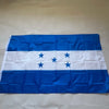 A blue and white flag of Honduras with five stars on a white stripe, displayed flat.