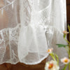 Elegant white floral lace tablecloth with sheer fabric and delicate embroidery