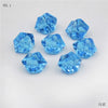 A collection of bright blue, faceted crystal ice cube acrylic stones for decorative use.
