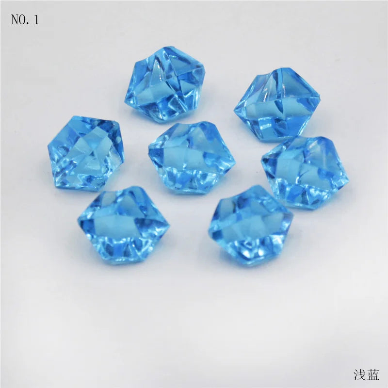 A collection of bright blue, faceted crystal ice cube acrylic stones for decorative use.