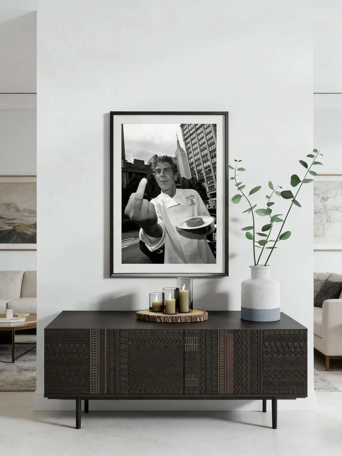 Framed black and white photograph of Anthony Bourdain making a peace sign