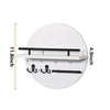 A white circular wall key holder with a shelf and multiple hooks for keys.