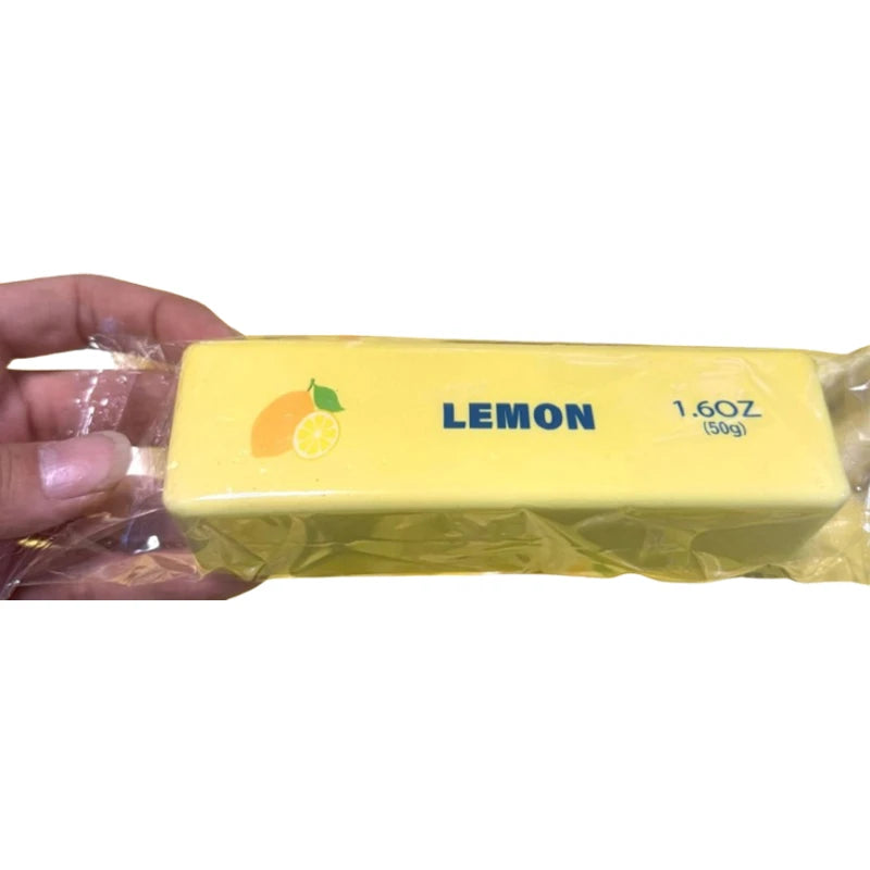 Jouet anti-stress jaune LEMON 1.6oz (50g) dans un emballage en plastique transparent.