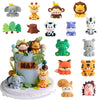 A collection of various jungle and safari animal cake toppers including elephants, monkeys, tigers, and other wildlife figure