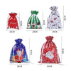 A set of five festive drawstring Christmas gift bags featuring Santa and snowman designs in red, green, and white.