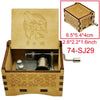 A wooden music box with a lid featuring a lion head design and an internal mechanism.