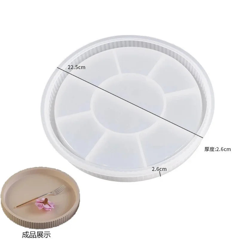 A white silicone mold with multiple depressions for crafting gypsum, concrete, and resin.