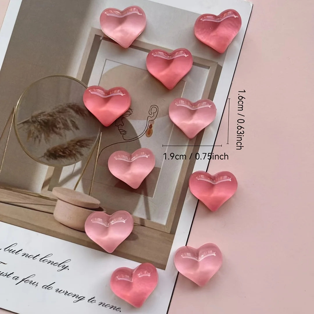 A set of ten pink heart-shaped resin refrigerator magnets displayed on a light background.