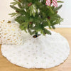 A white plush faux fur Christmas tree skirt with gold star accents and a green fir tree on top.