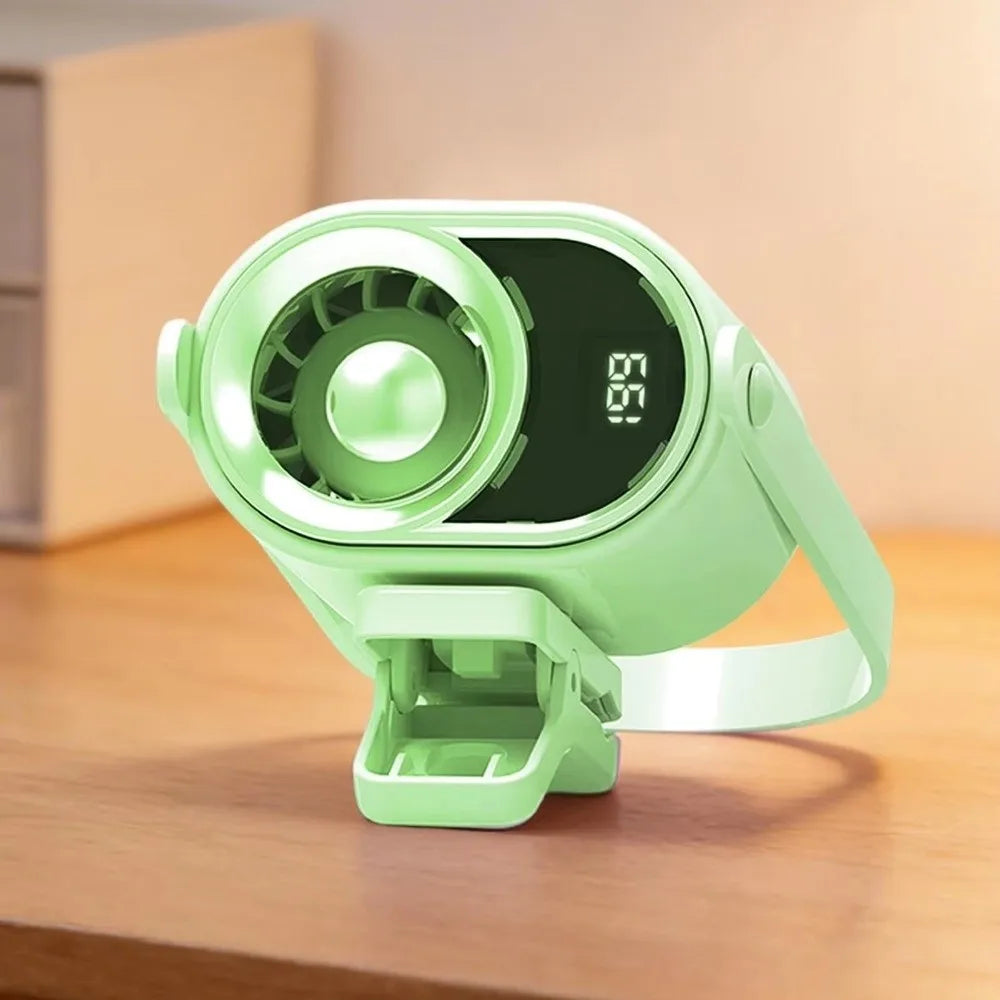A lime green clip-on mini electric fan with a circular grille and digital display resting on a wooden surface.