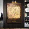 Vintage retro world map canvas wall art with gold frame displayed on a dark wood panel.
