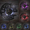 A collection of vintage vinyl record wall clocks featuring kitchen and heart designs mounted on a brick wall.