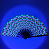 UV fluorescent handheld folding fan displaying a vibrant spectrum of colors against a blue background.