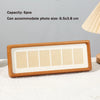 A solid wood photo frame display stand with six individual slots for photos.