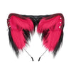 A pair of vibrant pink and black faux fur fox ears headband for cosplay or themed parties.