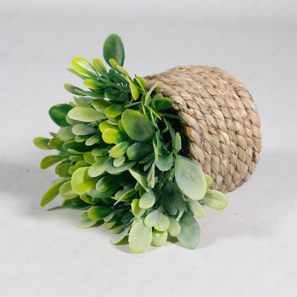 A vibrant green artificial succulent plant is displayed in a natural woven basket pot.