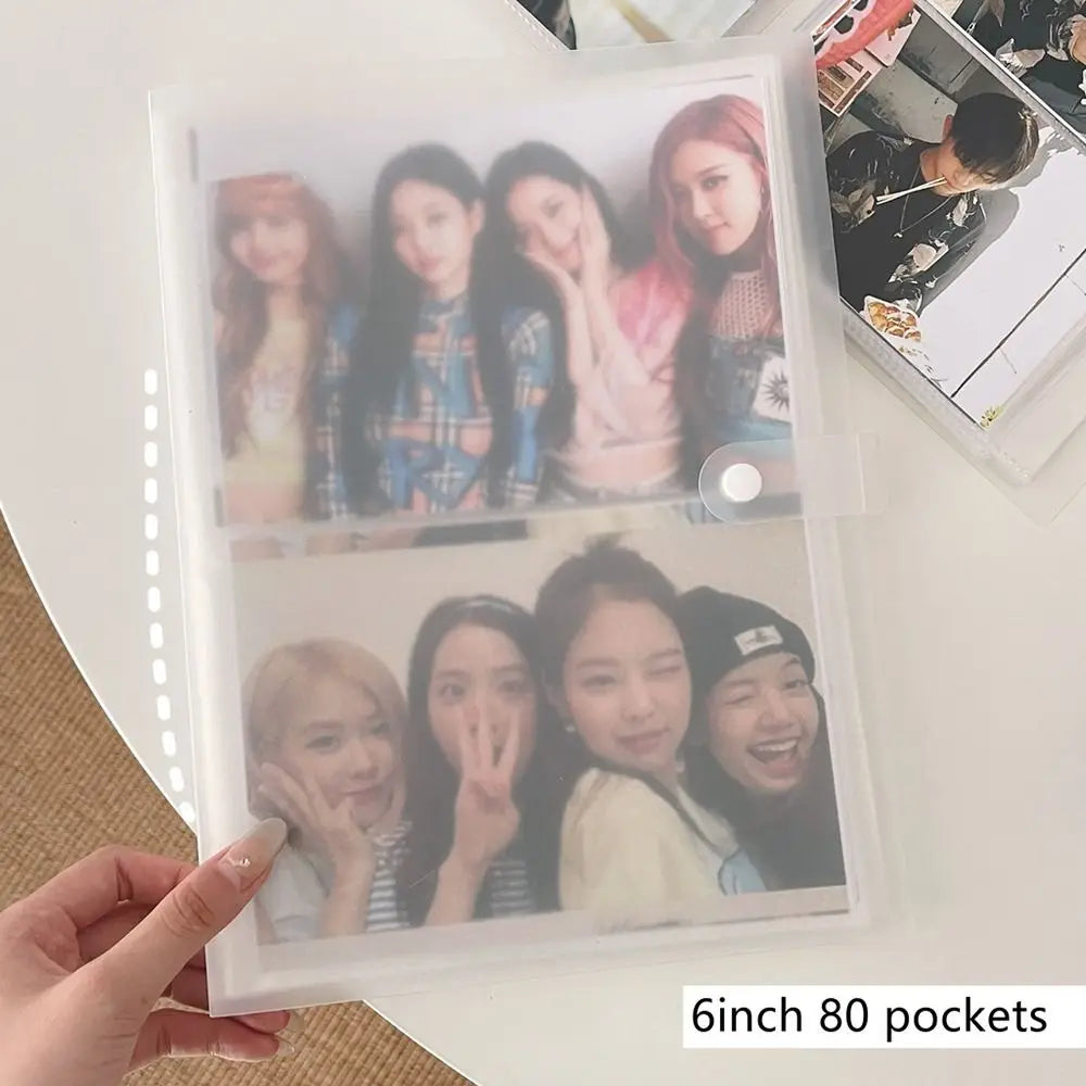 A clear photo album with 80 pockets displaying several photos of female idols.