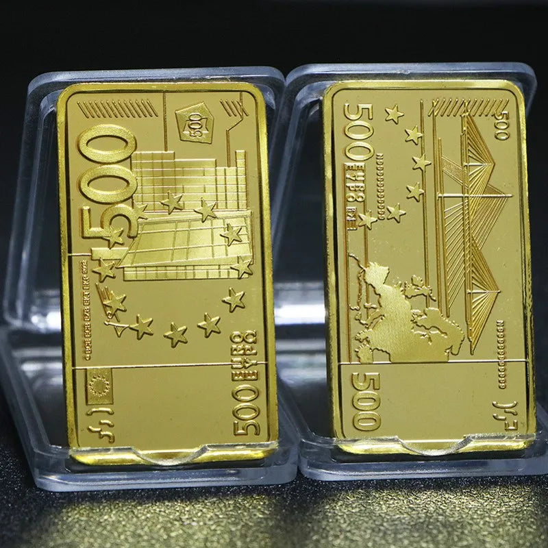 Two gold plated bullion ingots labeled 500 and 500 in a clear plastic holder.