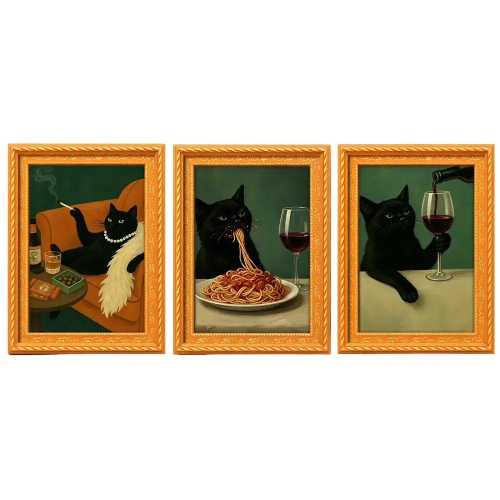 Three framed paintings featuring black cats enjoying food and wine, set in vintage wooden frames.