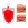 A bottle of watermelon lip oil gloss with before and after images showing lip color improvement