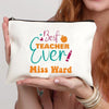 A cream-colored canvas makeup bag with pink and orange text that reads Best Teacher Ever Miss Hard