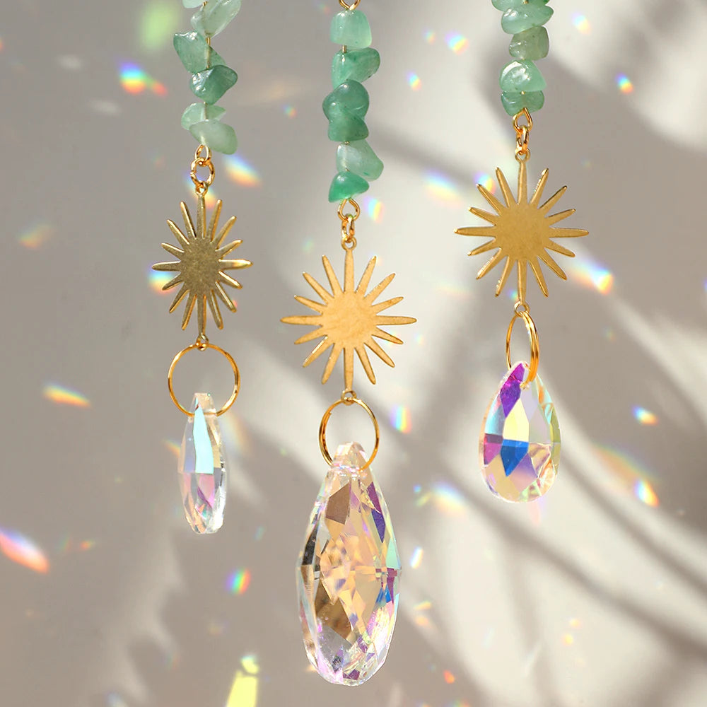 Handcrafted moon crystal suncatcher featuring a gold pendant with a faceted prism gemstone.