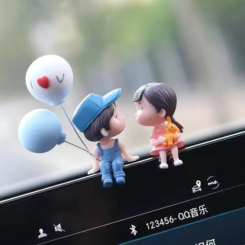 A set of cute couple balloon car ornaments featuring a small figure and a balloon.