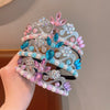A set of three ornate silver and pink pearl headbands for girls and women.