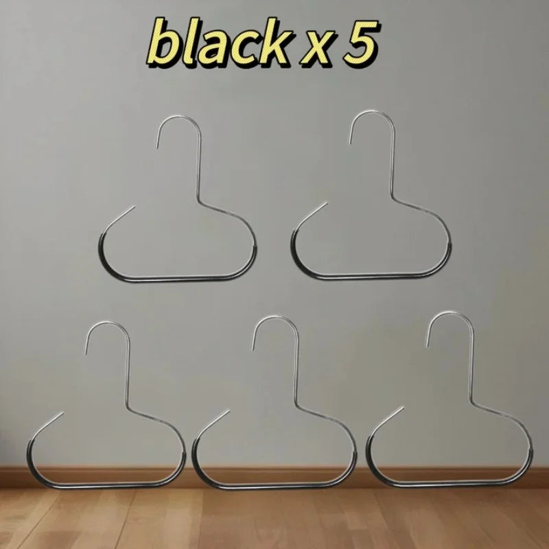 Five black metal hat organizer racks displayed against a white wall.