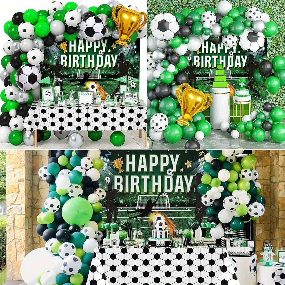 A festive balloon arch display for a birthday party featuring black, white, and lime green balloons and soccer balls.