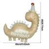 A beige foil balloon shaped like a cute, smiling dinosaur with a party hat and birthday message