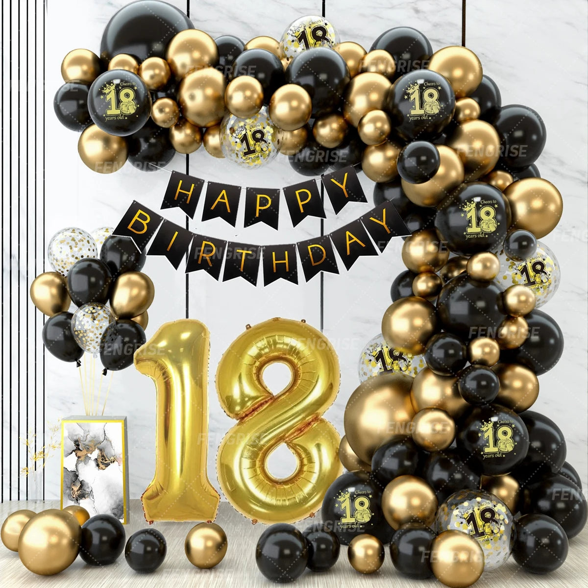 A large gold balloon forming the number 18 surrounded by black and gold latex balloons for a birthday celebration