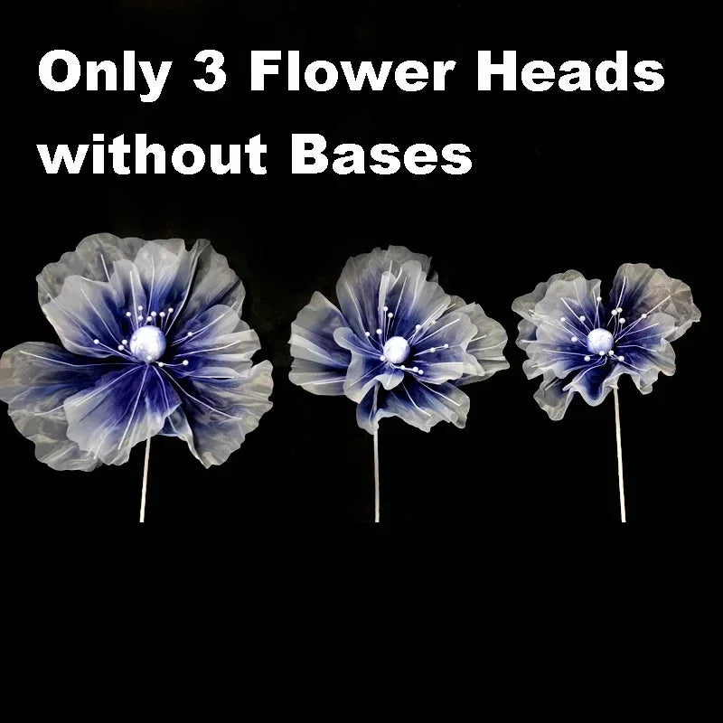 Three large, purple-blue velvet mesh flower heads without bases for wedding decoration.