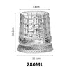 A clear crystal whiskey glass with a relief pattern and a textured base, measuring 7.8cm tall.