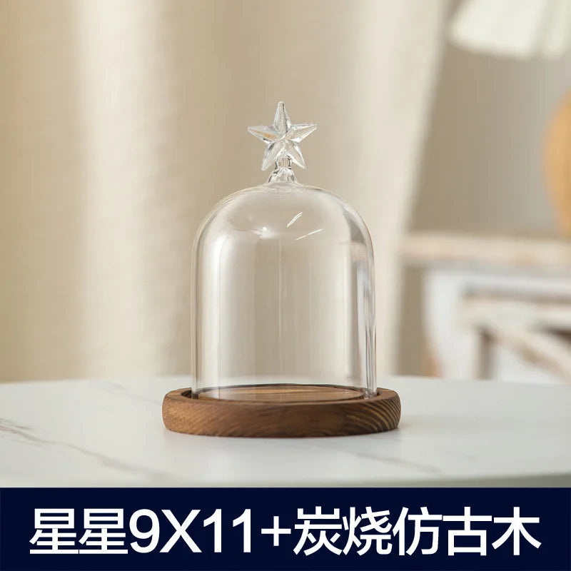 Glass aromatherapy candle holder with a star top and wooden base