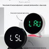 A black LED ambient light clock displaying LAU and LSL, showing brightness adjustment features.