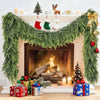 A realistic cedar garland decorated with Christmas elements and gifts displayed on a fireplace mantel.