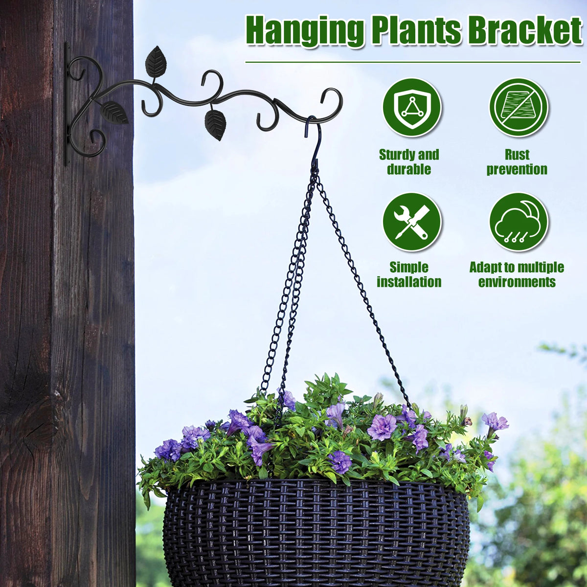 A hanging plants bracket with a wrought iron vine supports a potted plant against a wooden post.