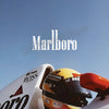 A close-up of a yellow and black Formula 1 helmet with Marlboro branding on a racing car.