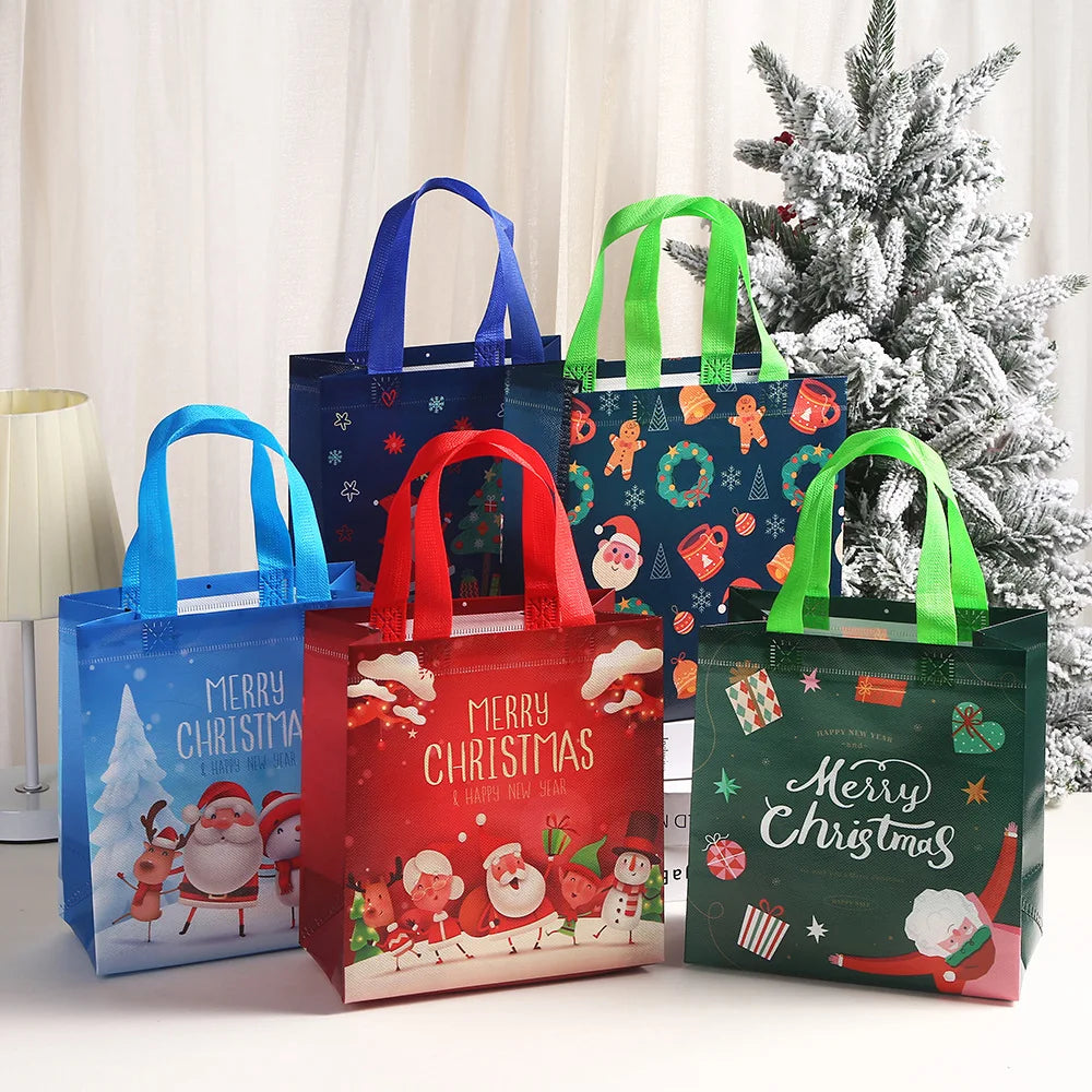 A collection of festive Christmas non-woven gift tote bags in blue, red, and green with holiday prints displayed in front of 