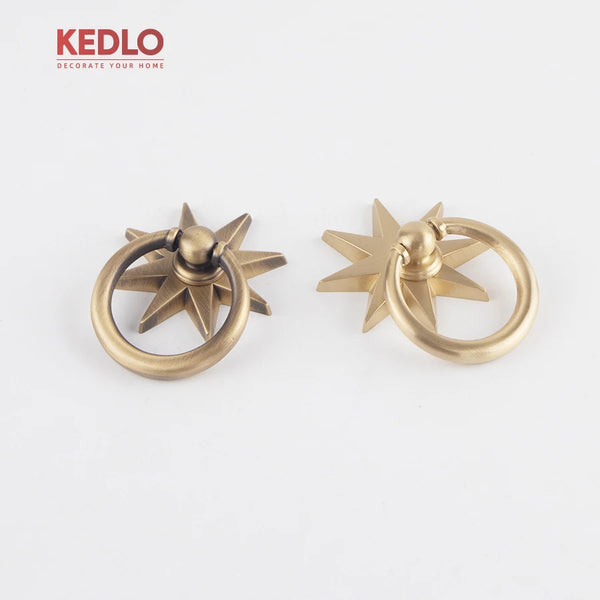 Solid brass star pendant cabinet knob with an antique finish.