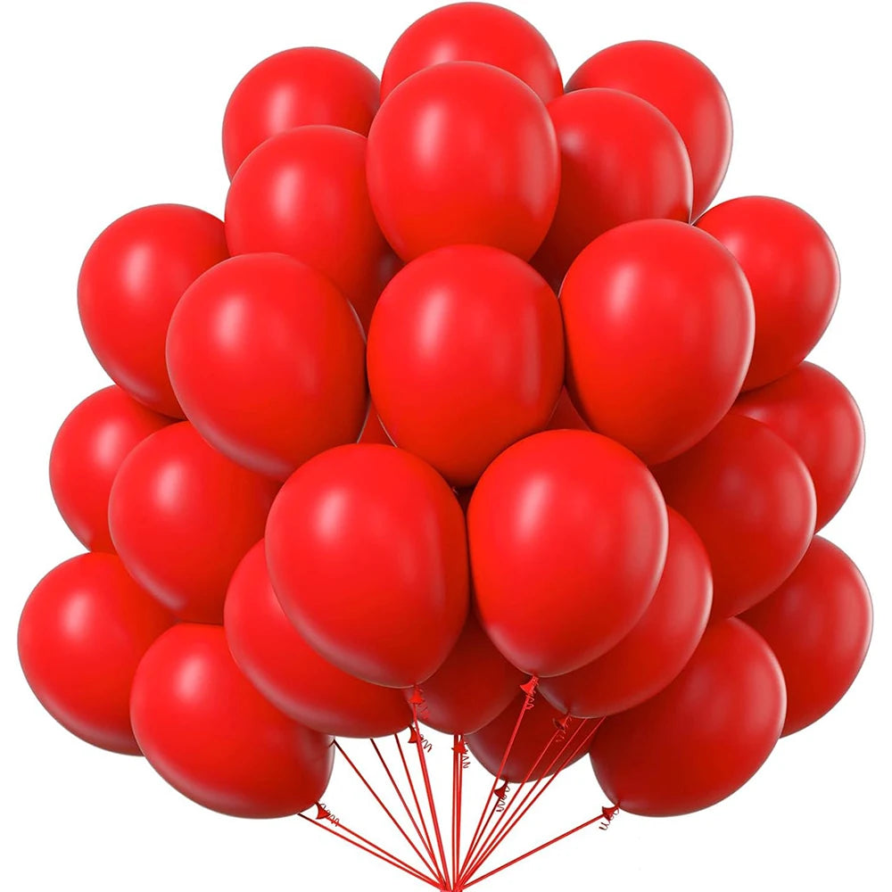 A cluster of bright red latex balloons tied together for party decoration.