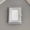 Silver mini photo card binder with decorative stars on the cover