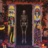 A vertical banner featuring a skull and skeleton figure with floral motifs, displayed in a dark doorway.