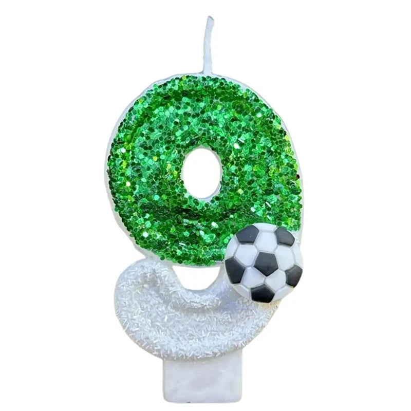 A green glitter number zero candle with a white soccer ball shape base.