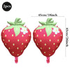 Two pink strawberry foil balloons with green leaves and white flowers, measuring 45cm long.
