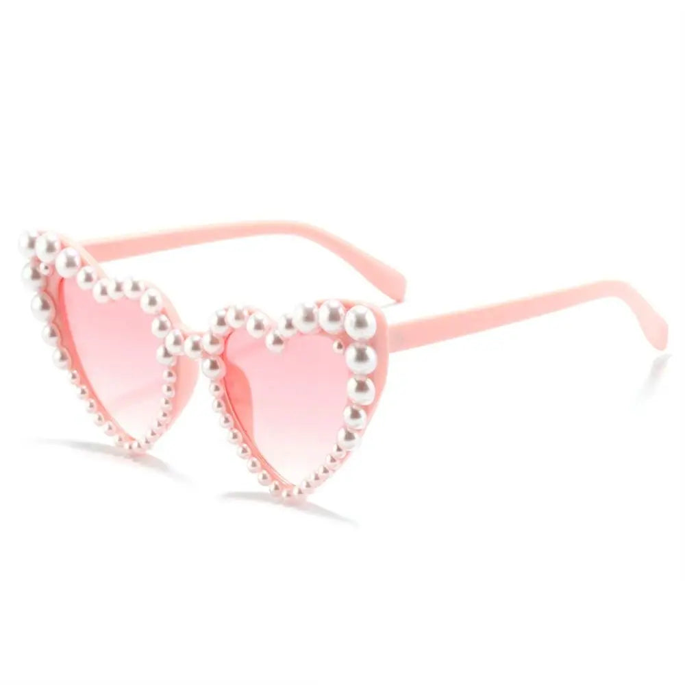 Pink heart-shaped sunglasses embellished with pearls for brides